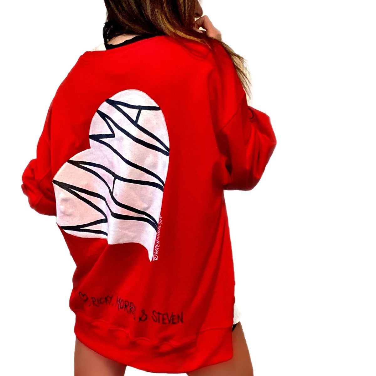 Oversized red sweatshirt. 'MAMA' painted in on back, inside white heart. Customized bottom hem with names of children, grandchildren, husband, etc. Up to 8 names able to be painted. Small red embroidered heart on each lower sleeve. Signed @wrenandglory.